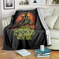 Black skull graphic blanket draped over couch, “Zero Fucks Given” typography