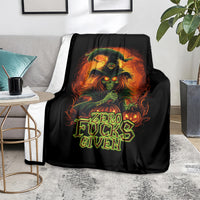 Black skull graphic blanket on floor, “Zero Fucks Given” flaming center print