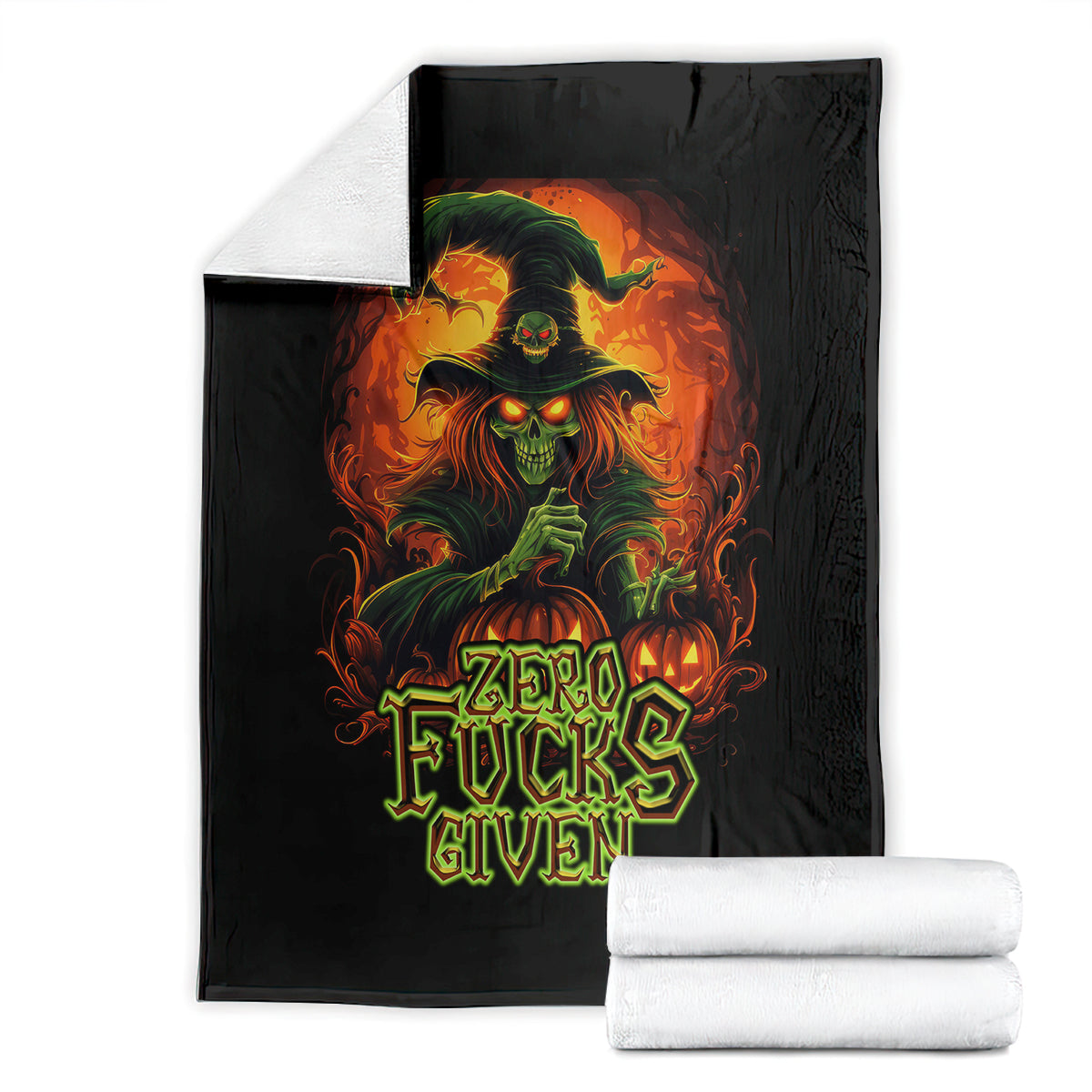 Black skull graphic blanket with “Zero Fucks Given” text, folded with white towels