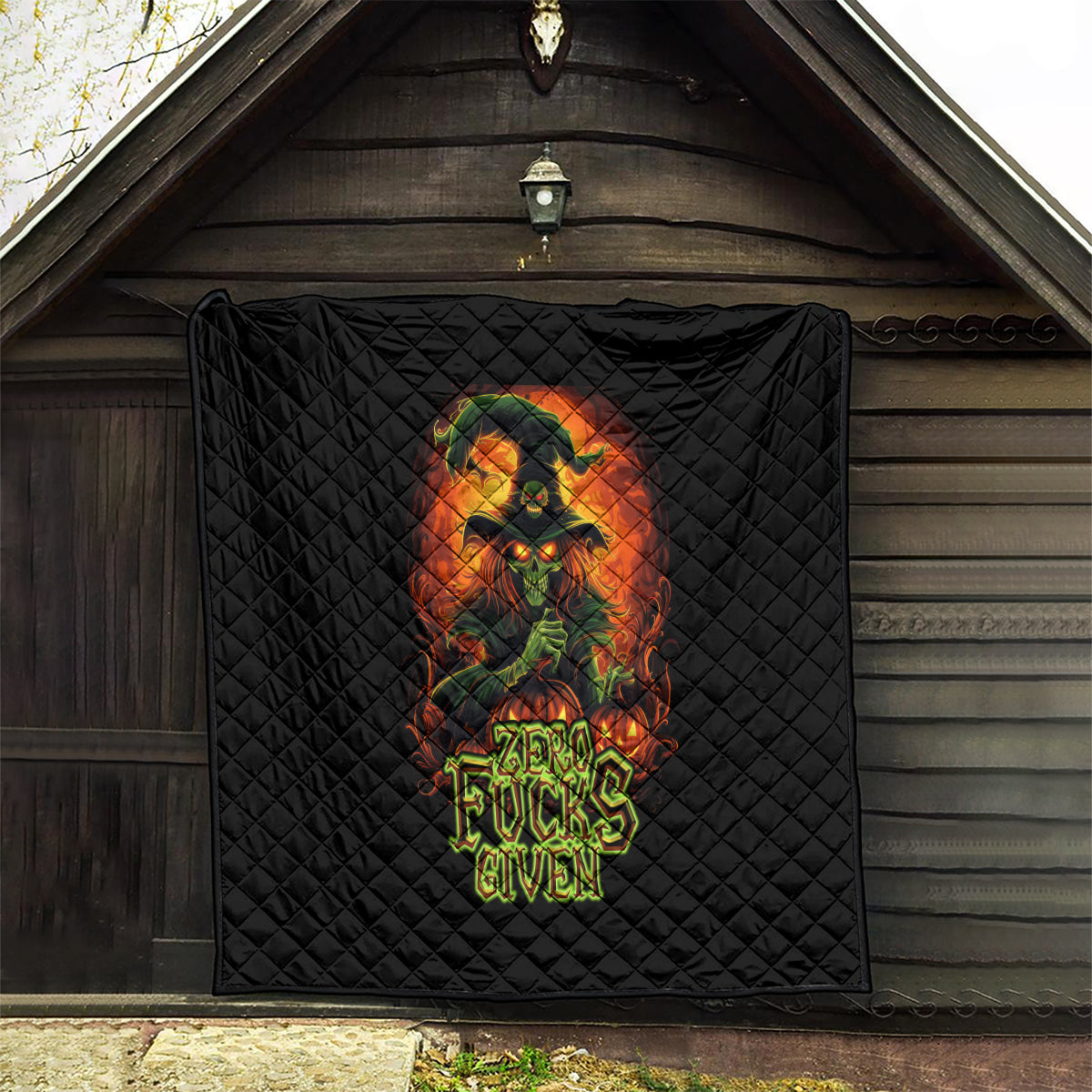 Black outdoor hanging quilt with witch skull graphic and neon Zero Fucks Given