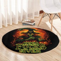 Round black area rug with fiery skull graphic and "Zero Fucks Given" word art
