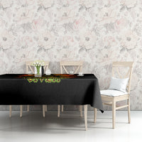 Black tablecloth with fiery skull artwork and green “Zero F**ks Given” text