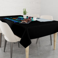 Black witch skull tablecloth draped over square dining table