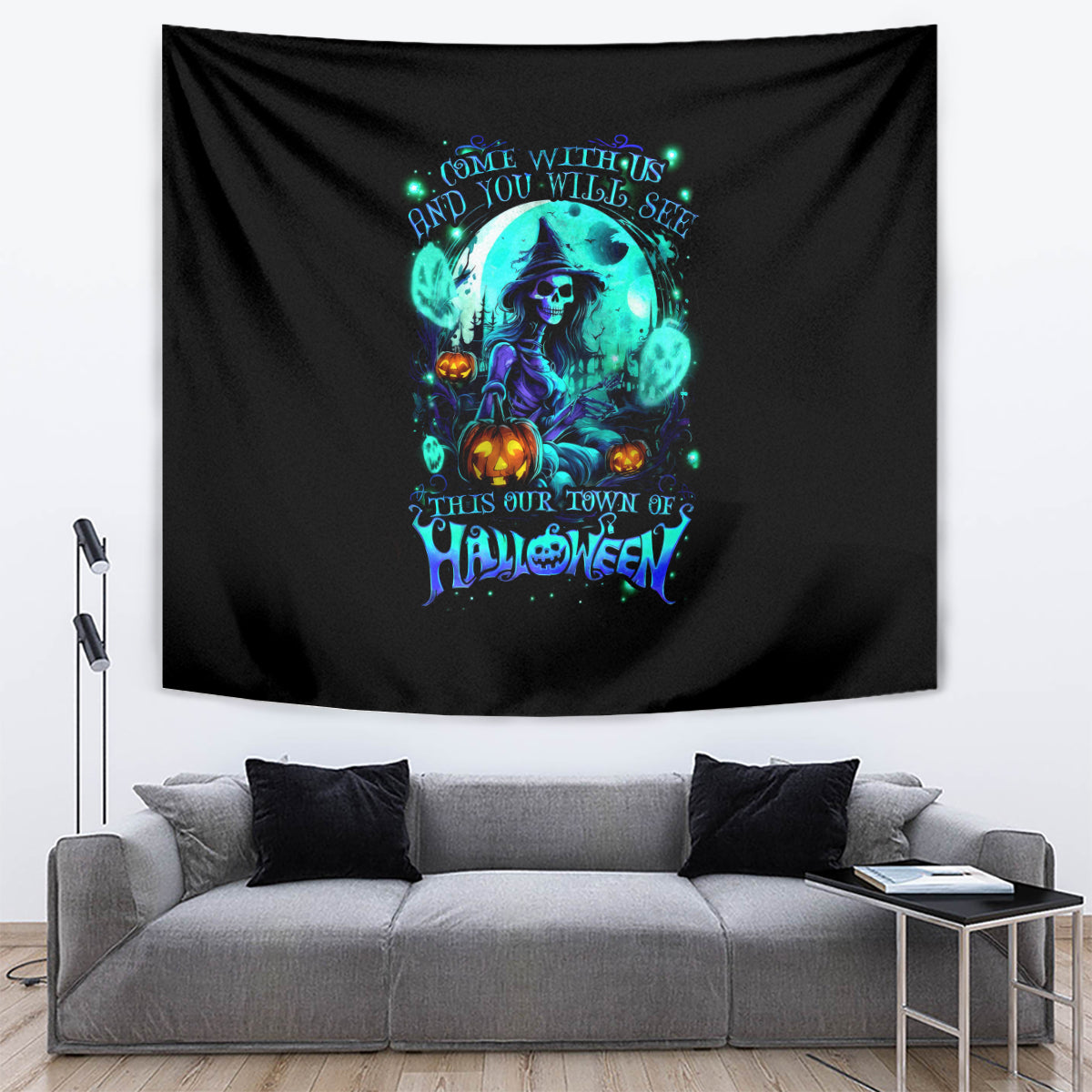 Black wall tapestry with teal witch skull graphic, pumpkins, and Halloween lettering