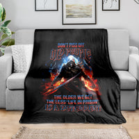 Black warrior skull graphic blanket with fiery sword and slogan design
