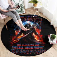 Black round carpet with warrior skull and fiery graphic, “Don’t…” themed text