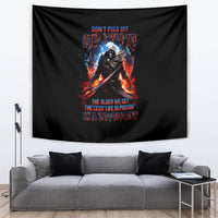 Black tapestry showing a fiery warrior skull graphic with colorful lettering on it