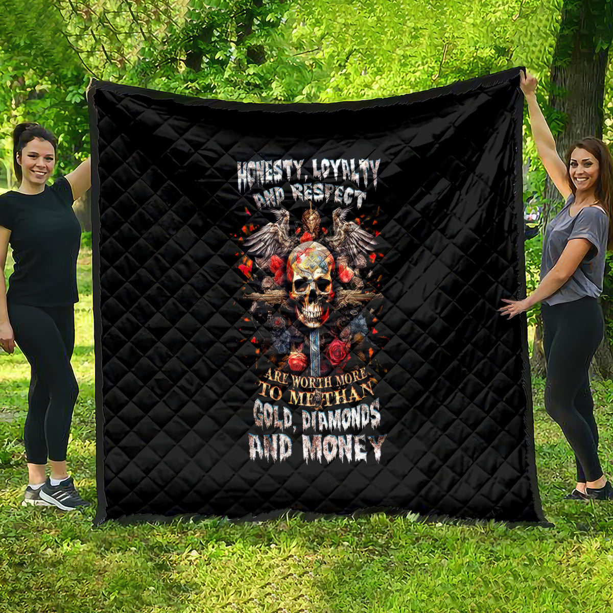 Black quilt blanket with quilted diamond pattern and skull graphic with bold text