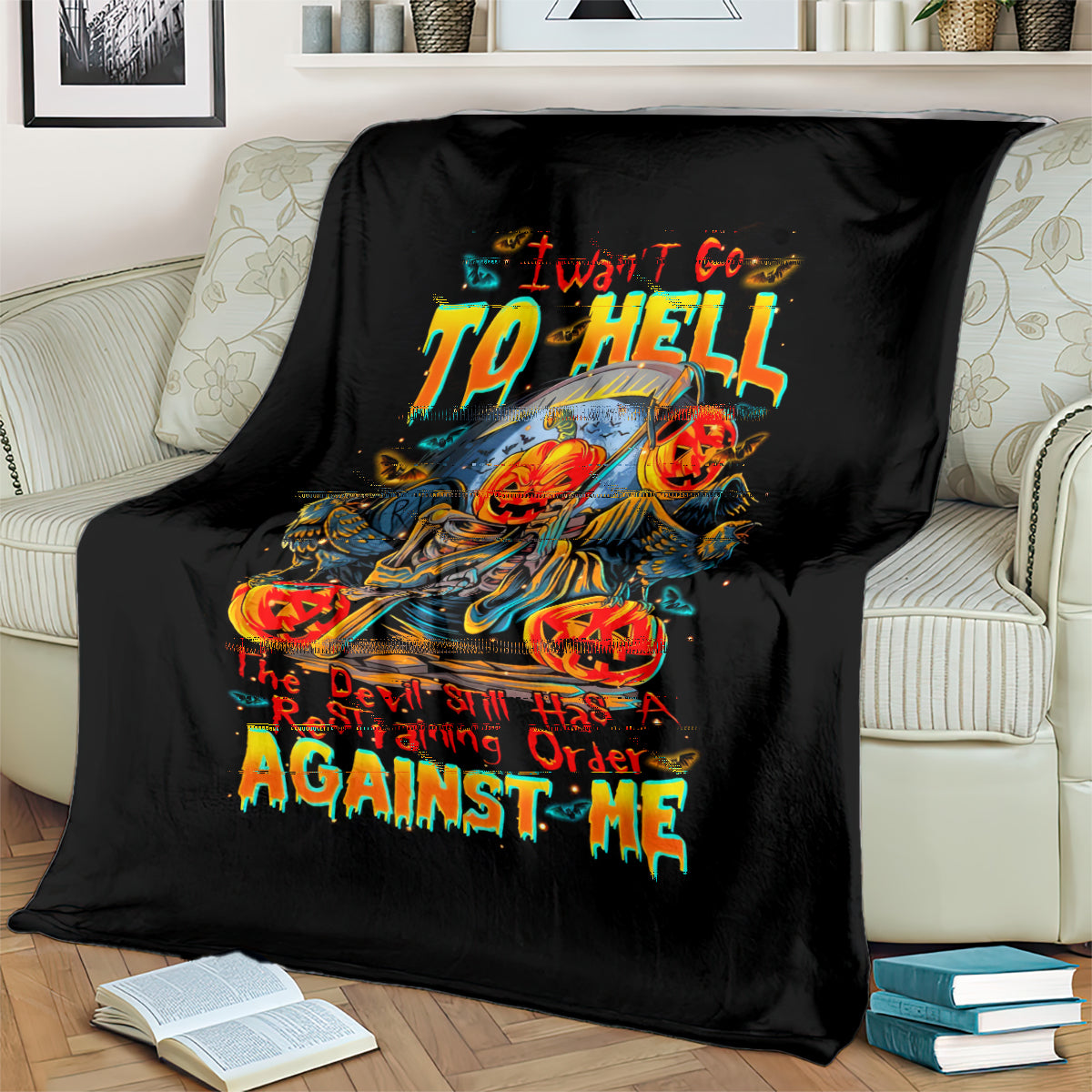 Black graphic blanket with colorful pumpkin skull skeleton and flaming “AGAINST ME” lettering.