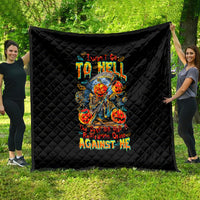 Black quilted blanket with diamond stitching and colorful skull-and-devil graphic