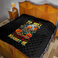 Black quilted bedspread with diamond quilt pattern and skull-and-devil graphic
