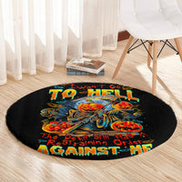 Black round horror graphic rug with skull rider center and colorful text, viewed from above
