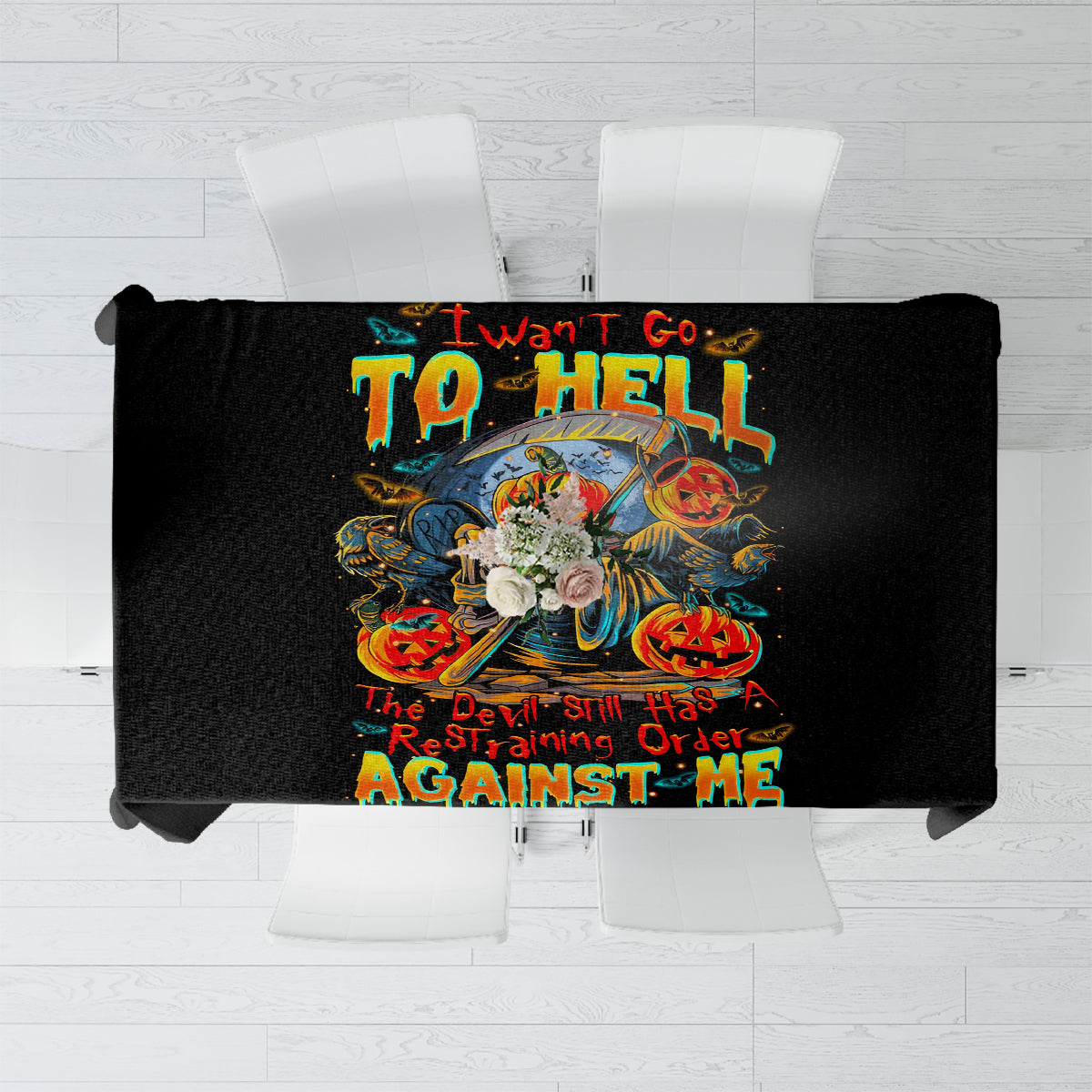 Black tablecloth with colorful devil-themed graphic and bold warning text in the center.