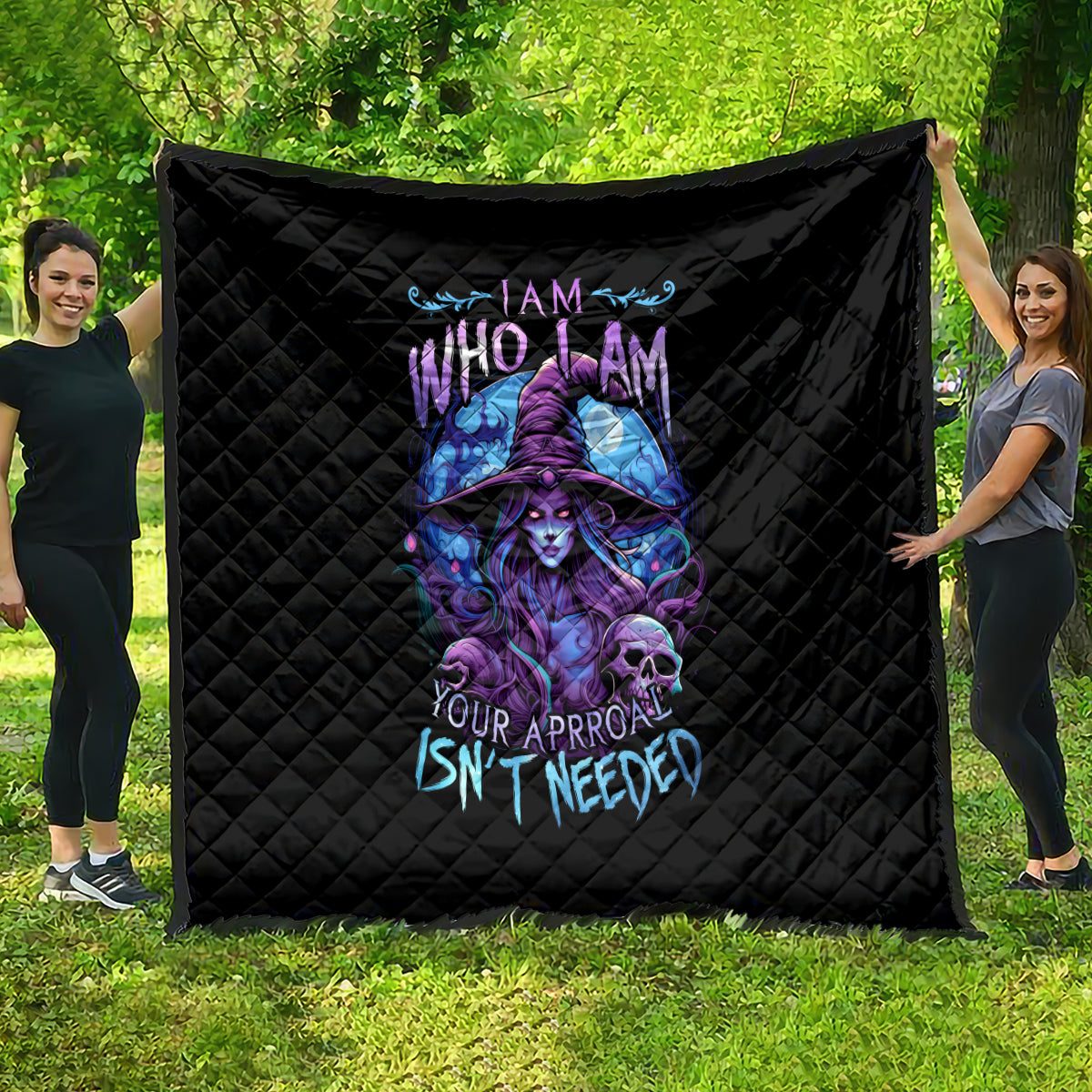 Black quilt blanket with quilted diamond pattern and purple-blue witch skull artwork