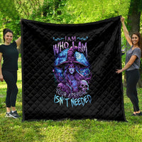 Black quilt blanket with quilted diamond pattern and purple-blue witch skull artwork