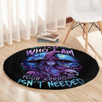 Black round rug close-up with purple-blue witch and skull, ISN'T NEEDED lettering