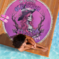 Pink witch skull beach blanket with fringe, purple-haired witch and skulls graphic