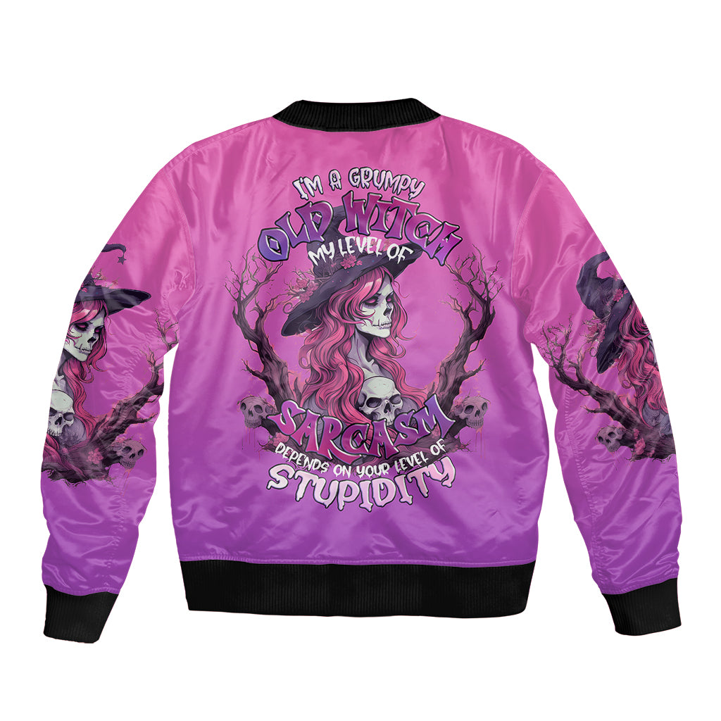 Pink unisex bomber jacket with black ribbed collar and witch skull back graphic