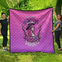 Pink quilt with diamond quilting and witch-skull graphic, purple and black print