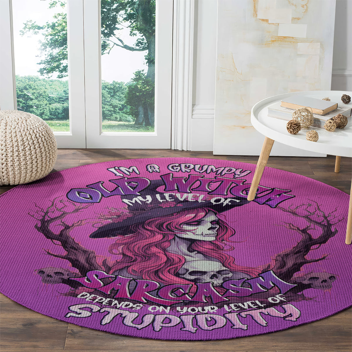Pink round area rug featuring grumpy witch skull and 'Sarcasm' text