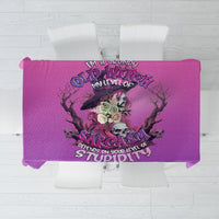 Purple tablecloth featuring a skull witch logo with text and dripping detail