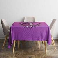 Purple round tablecloth with skull witch emblem centered and dark dripping trim