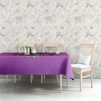 Purple tablecloth on a dining table with skull witch emblem and dripping motif