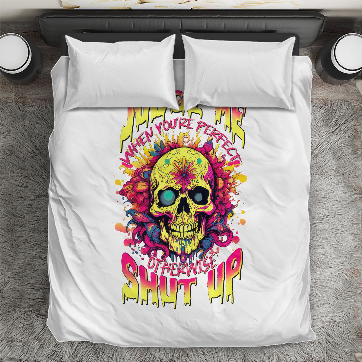 White bedding set with neon skull print centered on duvet and two pillowcases