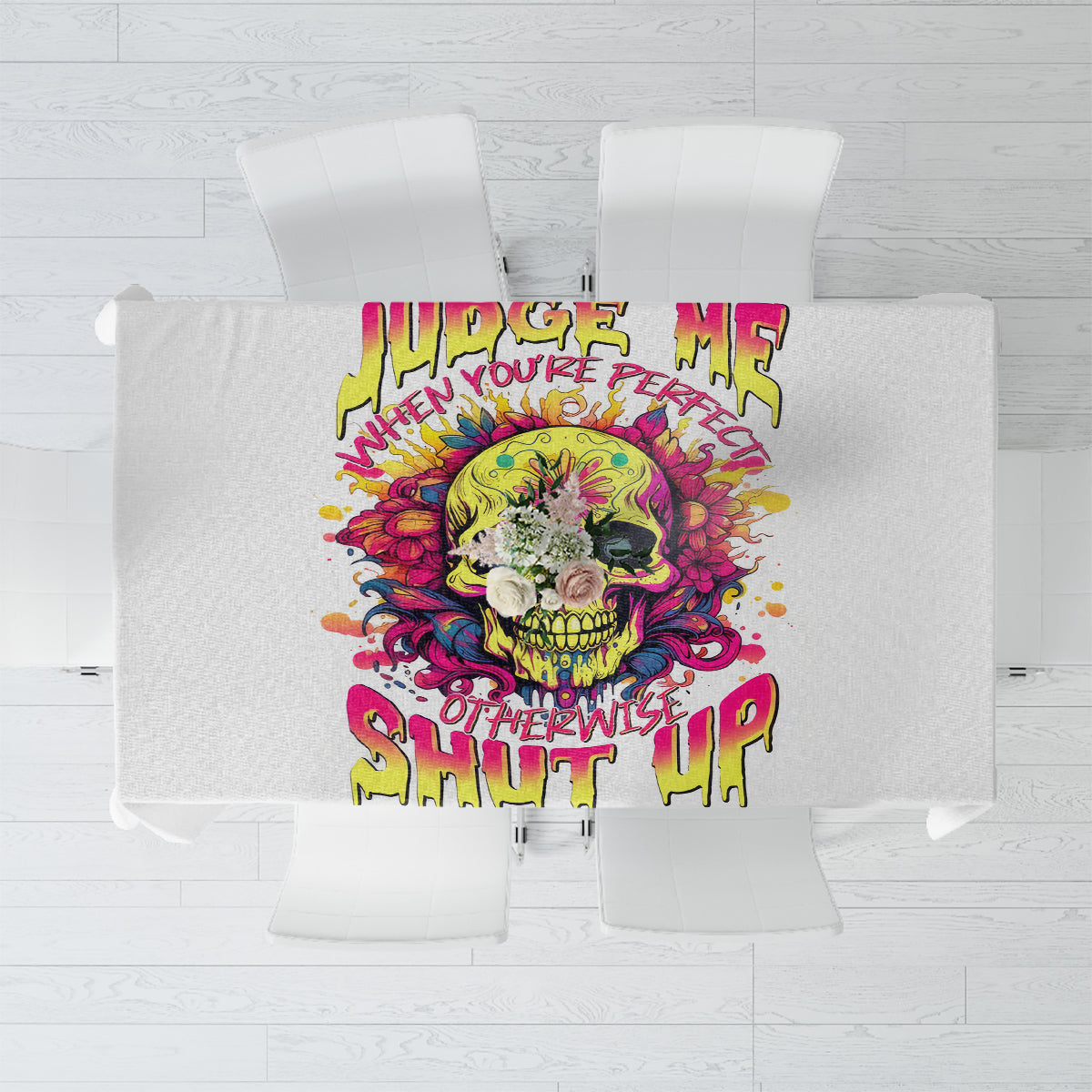 White tablecloth with colorful skull graphic and bold text print