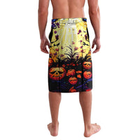 Black swim shorts with pumpkin and skull graphics, elastic waistband