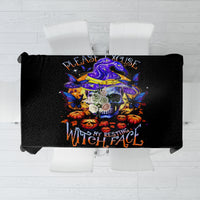 Black Halloween tablecloth laid flat with colorful skull and “Please Excuse My Resting Witch Face” text.