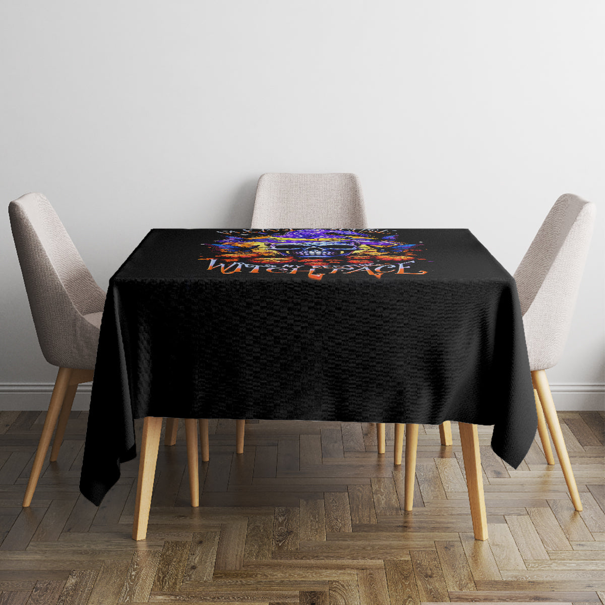 Black Halloween square tablecloth with colorful skull graphic on top surface.