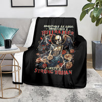 Black throw blanket with skull-and-angel rose design, smooth fabric drape