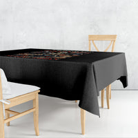 Black printed tablecloth with colorful angel-skull motif along the edge