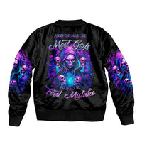 Black bomber jacket with purple witch skull graphic on back, ribbed cuffs and hem