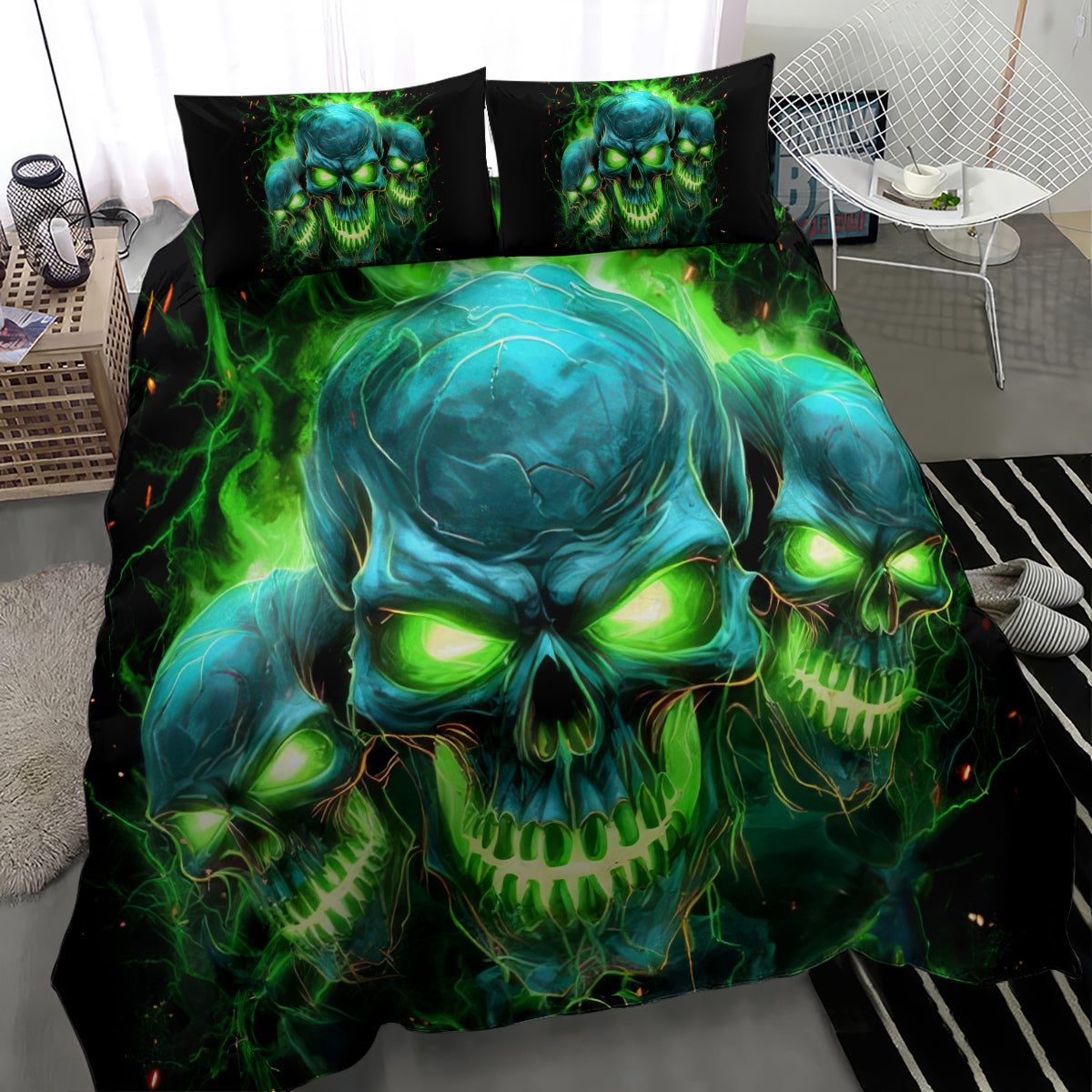 Black skull bedding set with glowing green-blue skull design; two pillowcases laid across bed