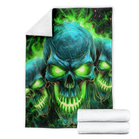 Skull flame graphic blanket, folded display with teal skull and neon green flame details