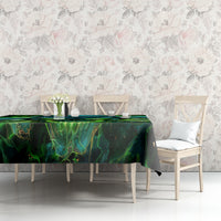 Black tablecloth with green-blue skull pattern on dining table, paired chairs visible