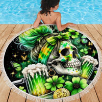 Circular black beach blanket with green skull, clover flowers, and white fringe border.