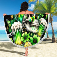 Black round beach blanket held up, showing green-haired skull, clovers, butterflies, and fringe.