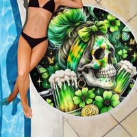 Black circular beach blanket with green skull artwork, butterflies, shamrock flowers, and fringe.