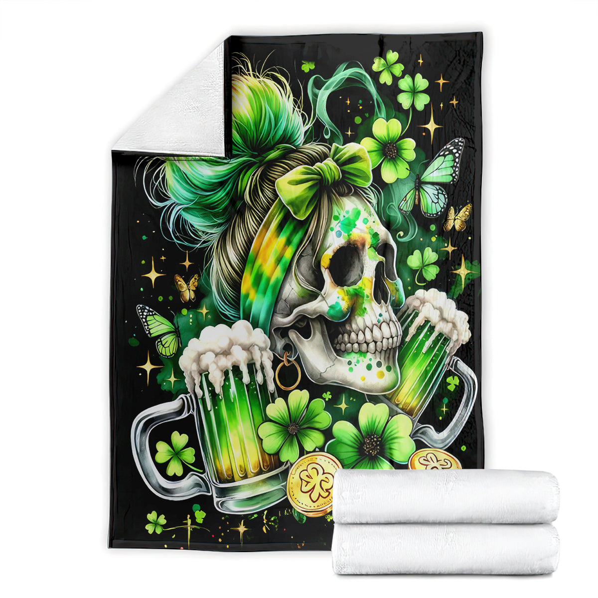 Black throw blanket folded with skull, rainbow hair, green clovers, and drink can print