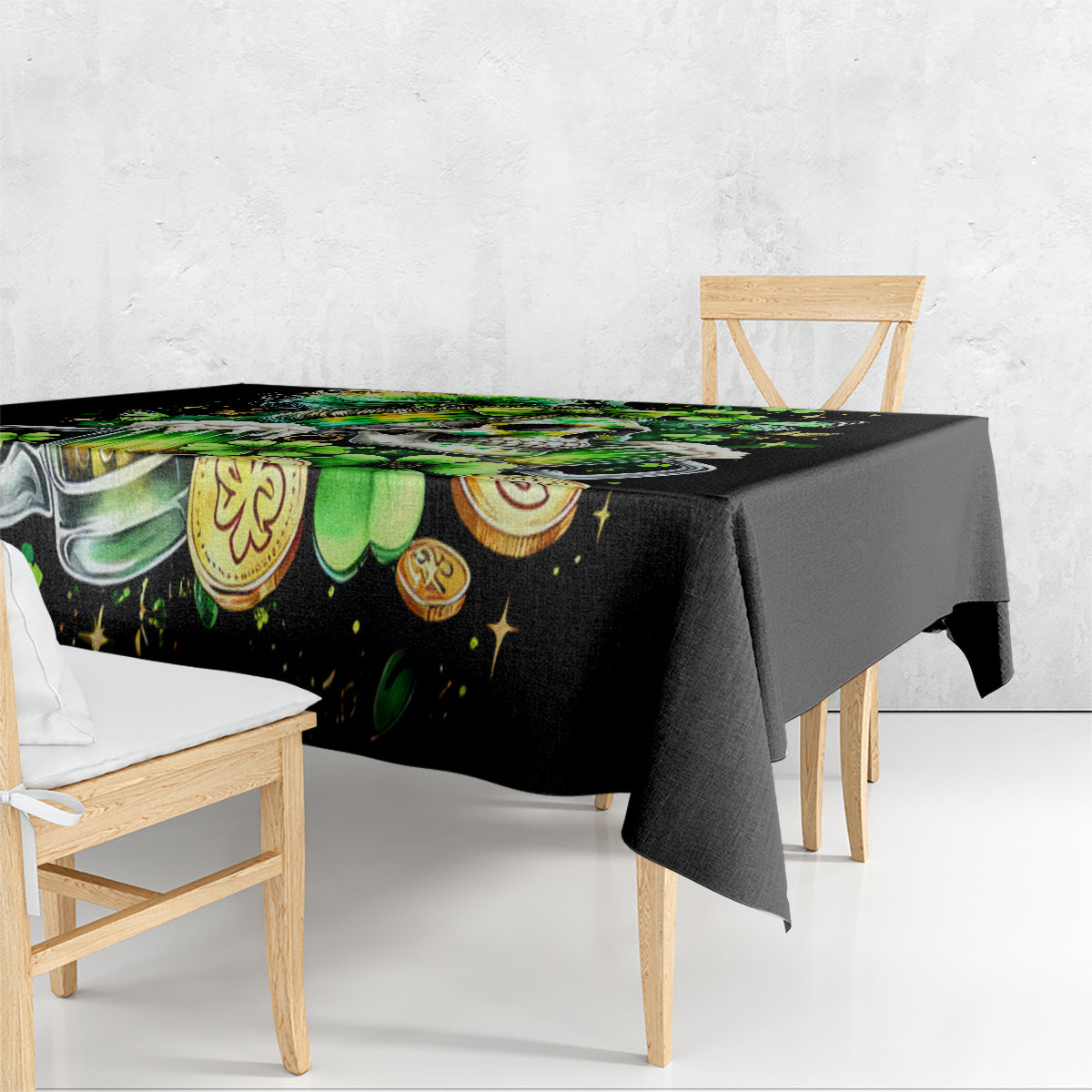 Black tablecloth draped over dining table edge, green skull and shamrock print