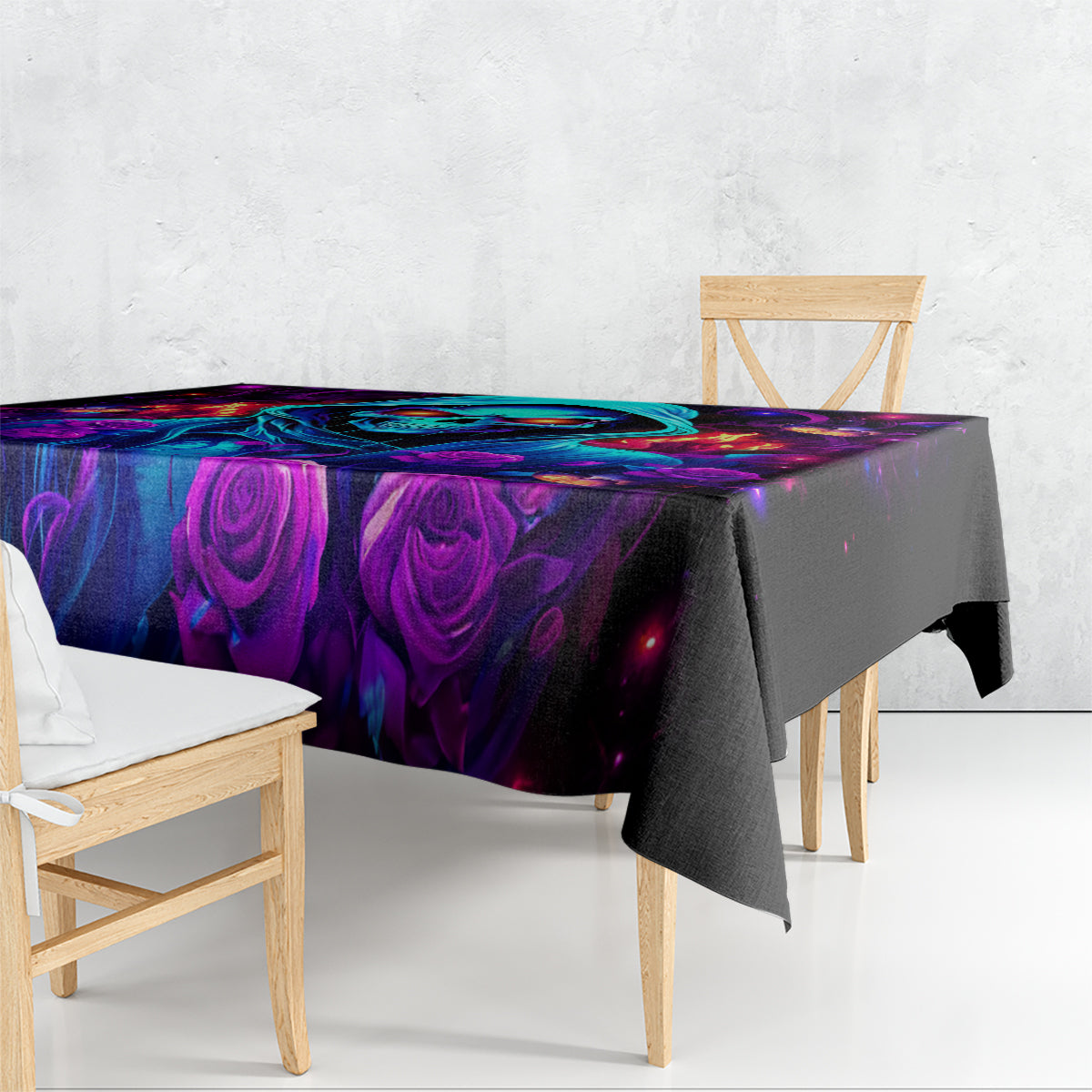 Black tablecloth with glowing purple and blue roses and neon abstract skull artwork.
