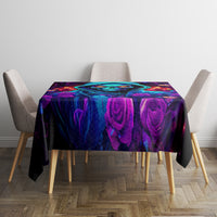 Black tablecloth with centered neon rose swirls and glowing blue skull face pattern.