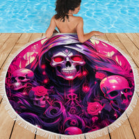 Round beach blanket with skull-and-rose graphic, fringed edge, spread on deck
