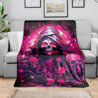 Skull rose blanket with magenta skull face and roses, spread over sofa
