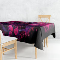 Rectangular tablecloth draped on table with dark skull and magenta rose print