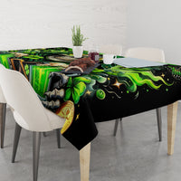 Rectangular green and black tablecloth with skull, shamrocks, and lucky coin motif