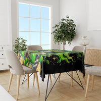 Green and black skull tablecloth with shamrocks and ornate coin details, dining room style